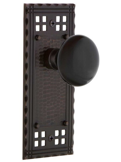 Pasadena Door Set with Black Porcelain Knobs in Timeless Bronze.